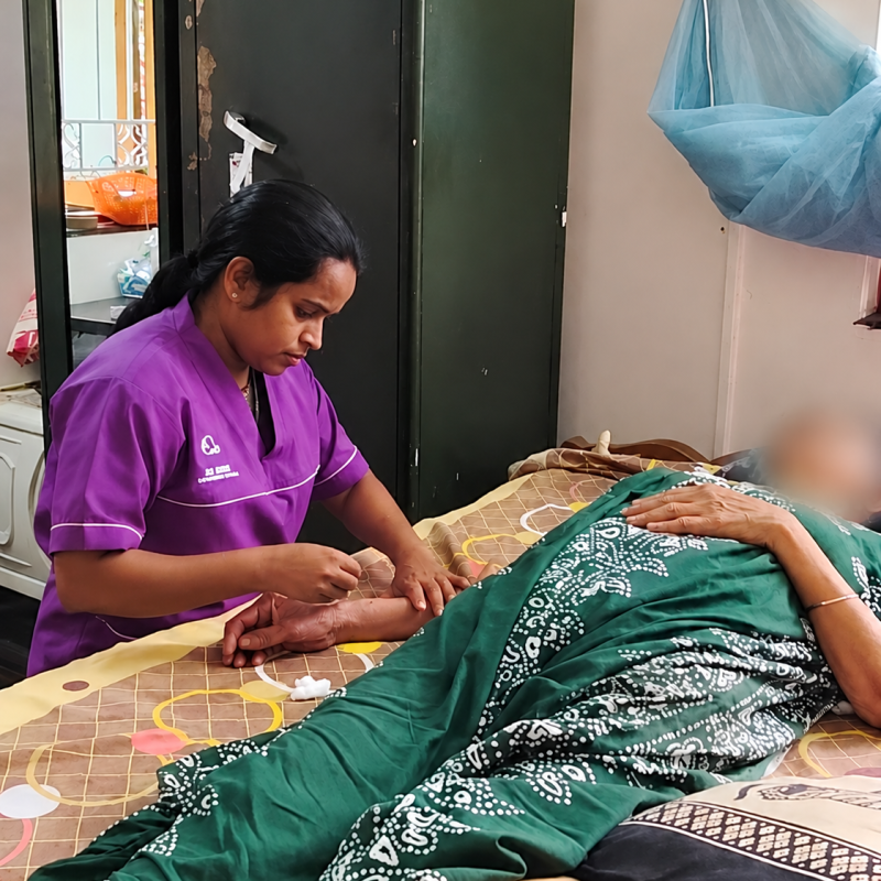 Home Caregiver Tending to Patient